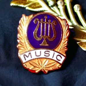 Golden/ blue beautiful music lapel pin from the '80s